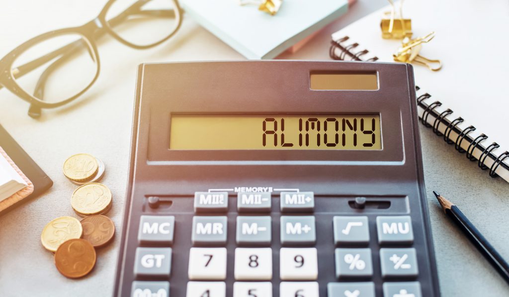 Word Alimony Written On Calculator On Office Table.